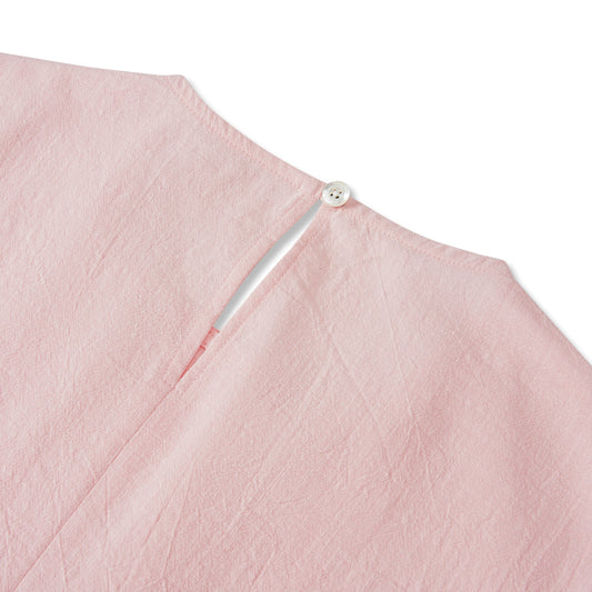 Side view of pink women's cotton blouse with elbow sleeves
