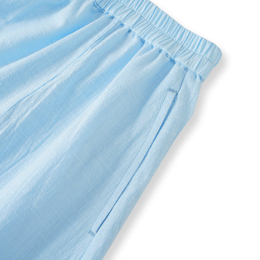 Side view of light blue women's cotton skirt with pockets