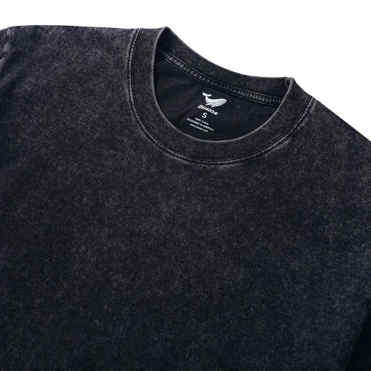 Close-up of pterosaur fossil graphic on men's black t-shirt