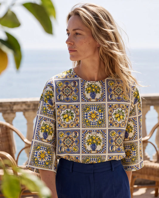 Women's blue aloha blouse with sunlit lemon pattern, elbow sleeve