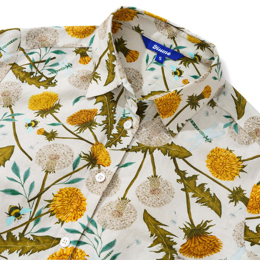 Close-up of dragonfly and dandelion print on women's shirt dress