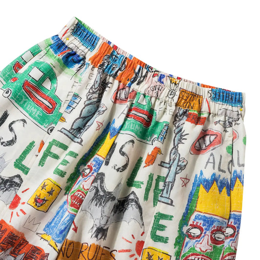 Women's ankle pants with pockets, orange graffiti design