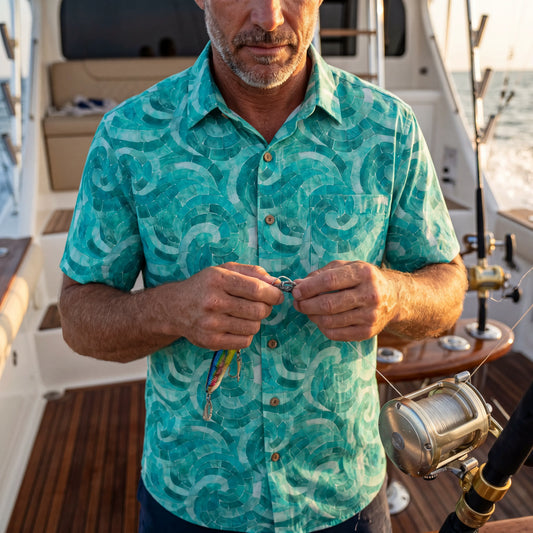 Model wearing Azure Seashell Whispers men's Hawaiian shirt