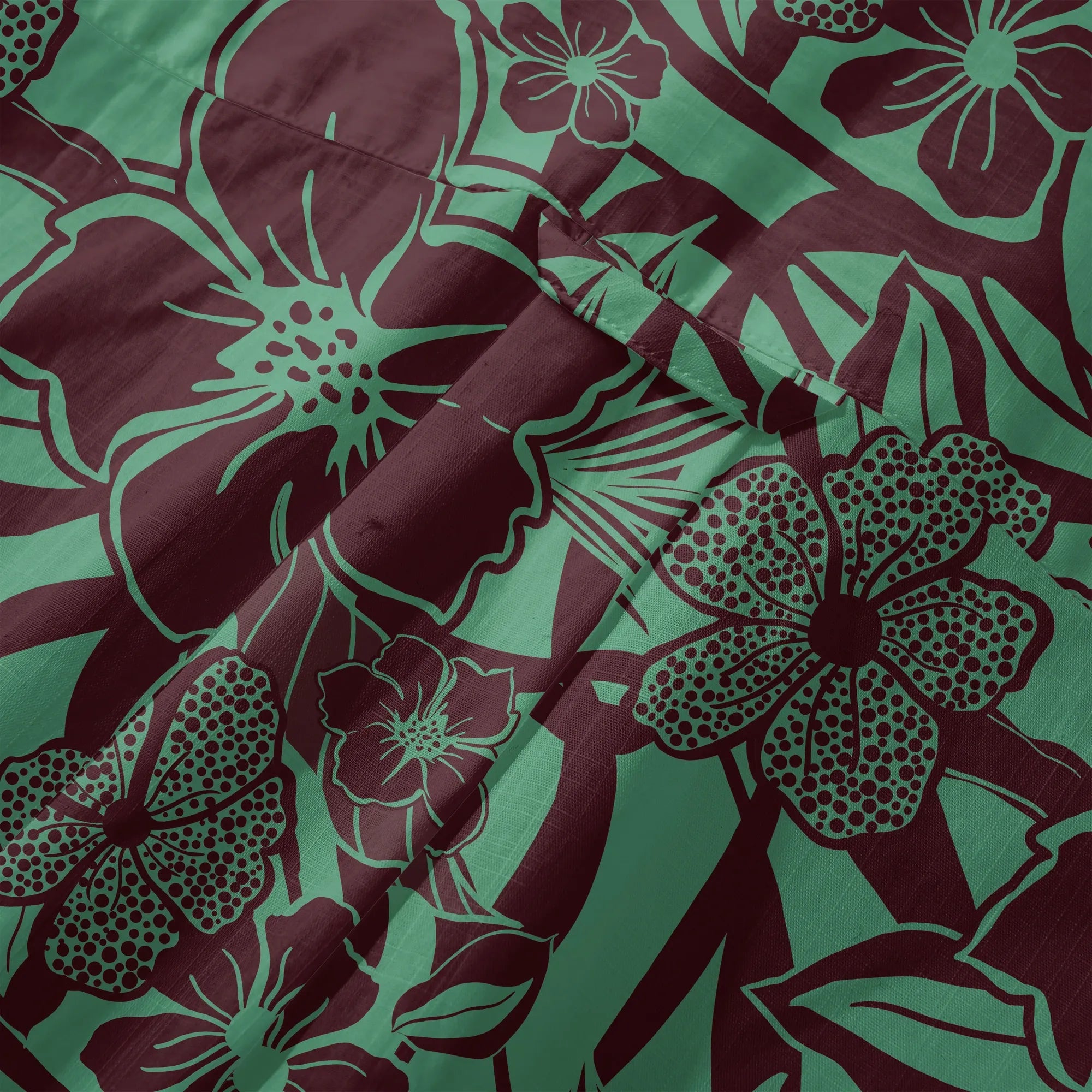 Detail of button-up closure on green Hawaiian shirt