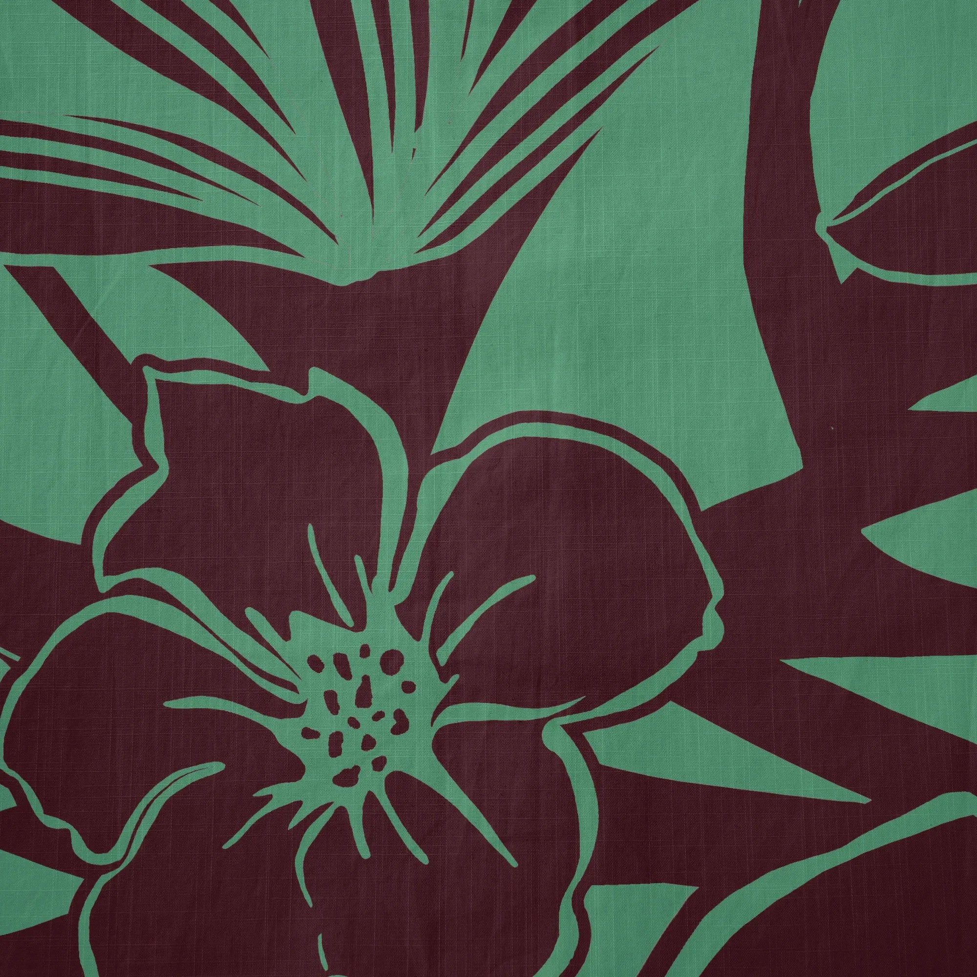 Men's green Hawaiian shirt styled for vacation