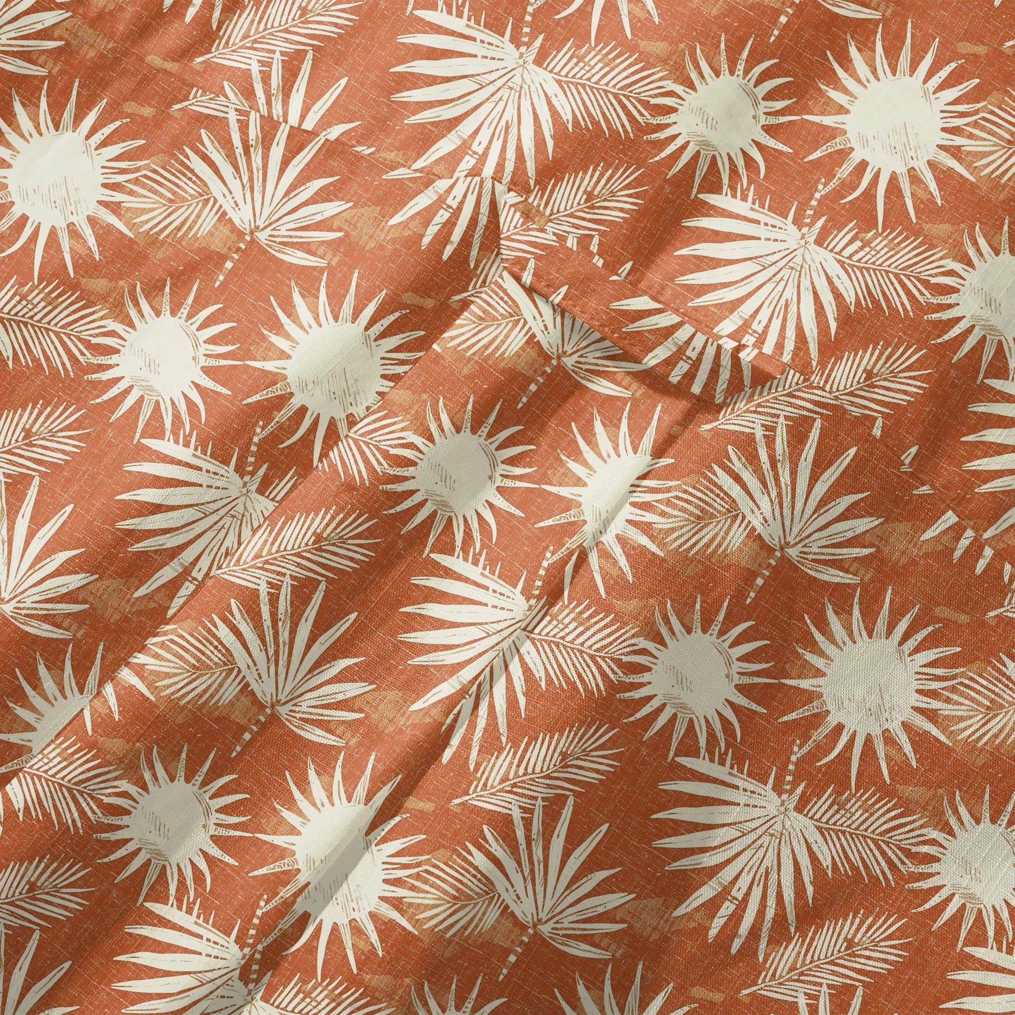 Pattern detail on orange Hawaiian shirt
