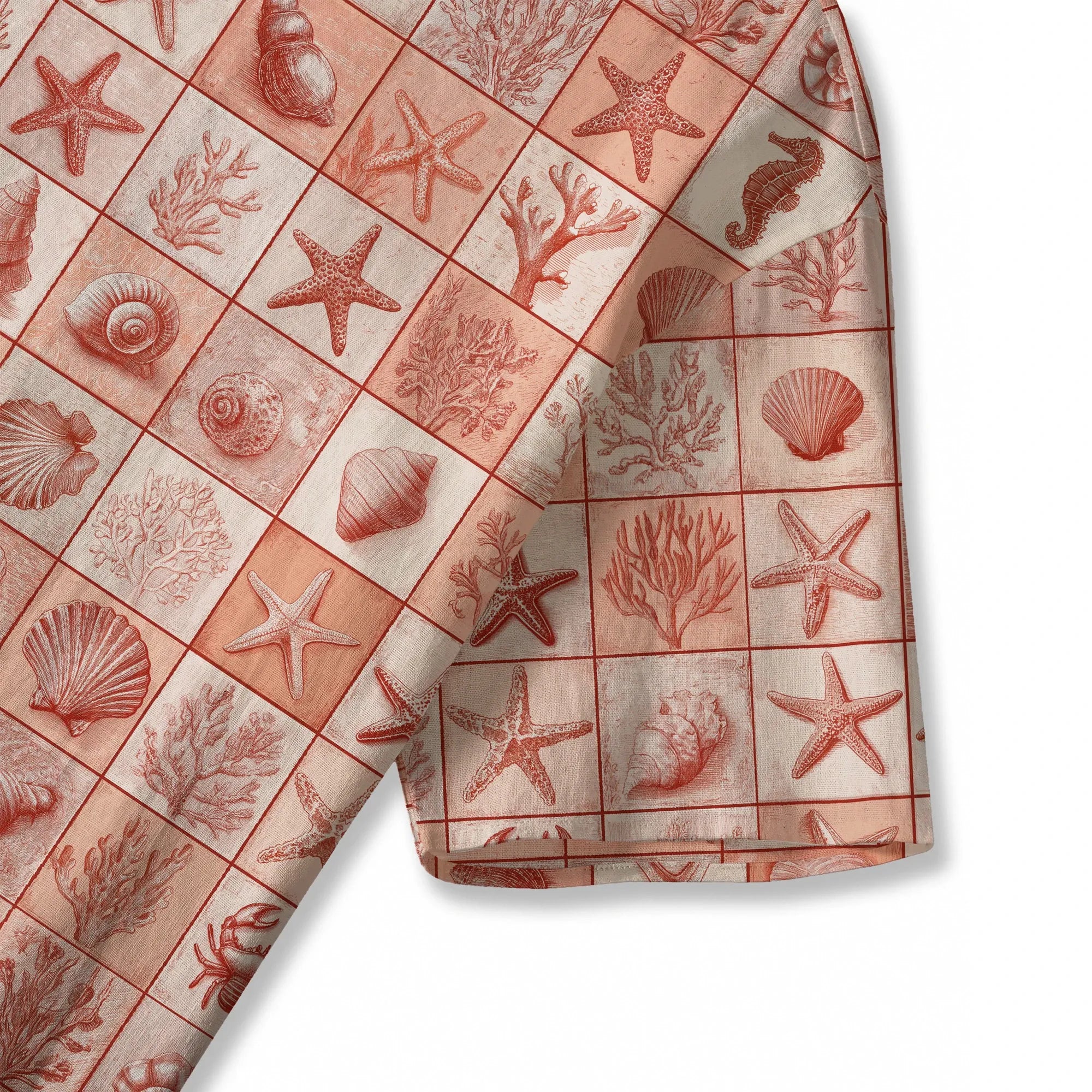 Close-up of coral red blouse with seashell and starfish design