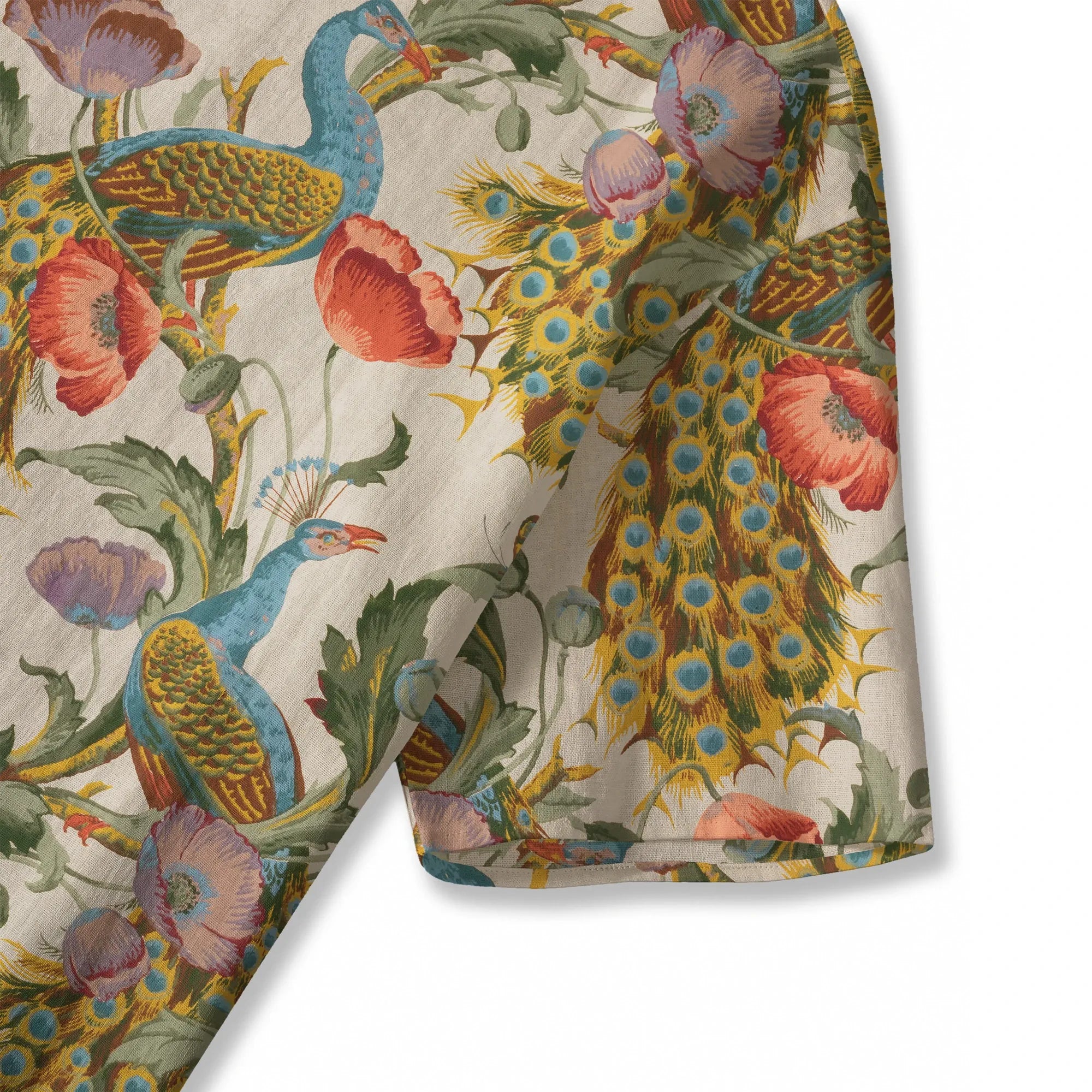 Close-up of peacock and flower print on beige blouse