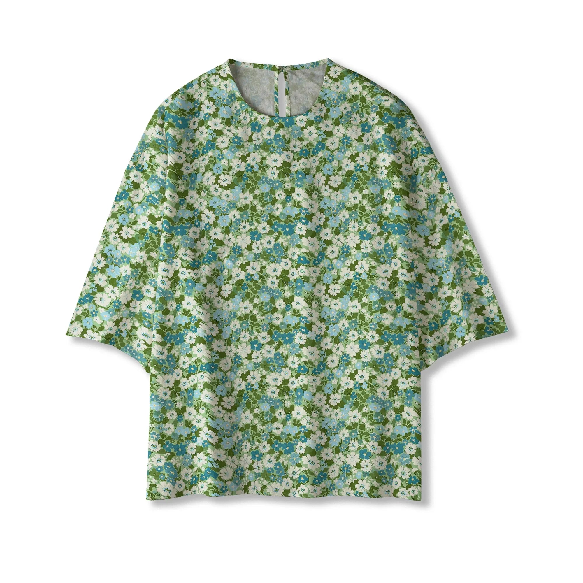 Detail of elbow sleeve on green floral blouse, women's